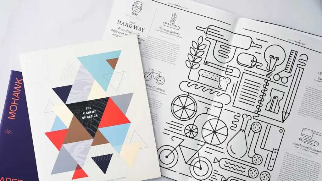 Aufgeschlagener Musterkatalog mit Papier- und Druckmustern